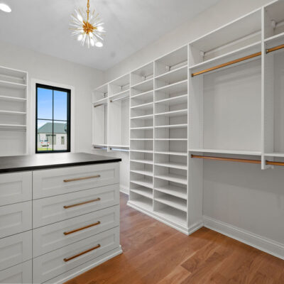 Custom Walk In Closet With Island and Window