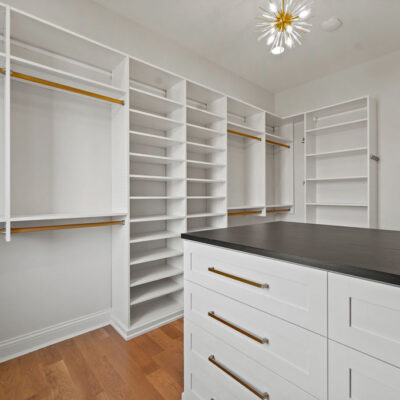 Custom Walk In Closet With Island and Window