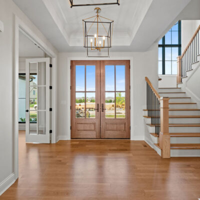 Entry With Tray Ceiling and Archway