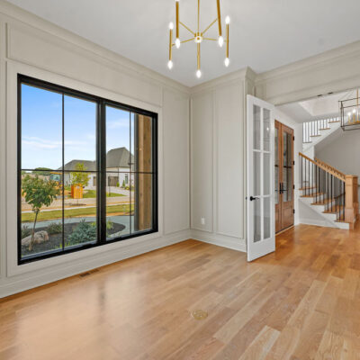 Home Office With Wall Molding and Glass Doors