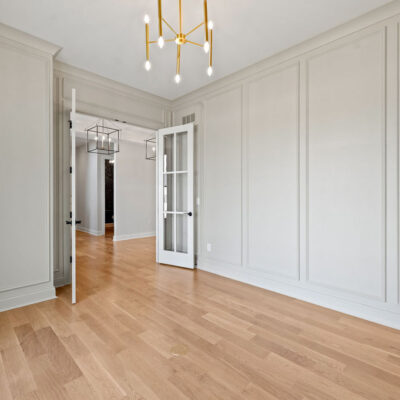 Home Office With Wall Molding and Glass Doors