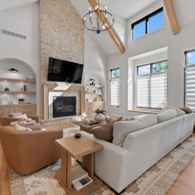 Great Room Cathedral Ceiling beams and stone fireplace with arched built-ins