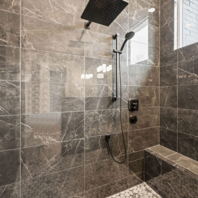 Oversized Shower With Transom Window and Bench multiple niches and shower heads