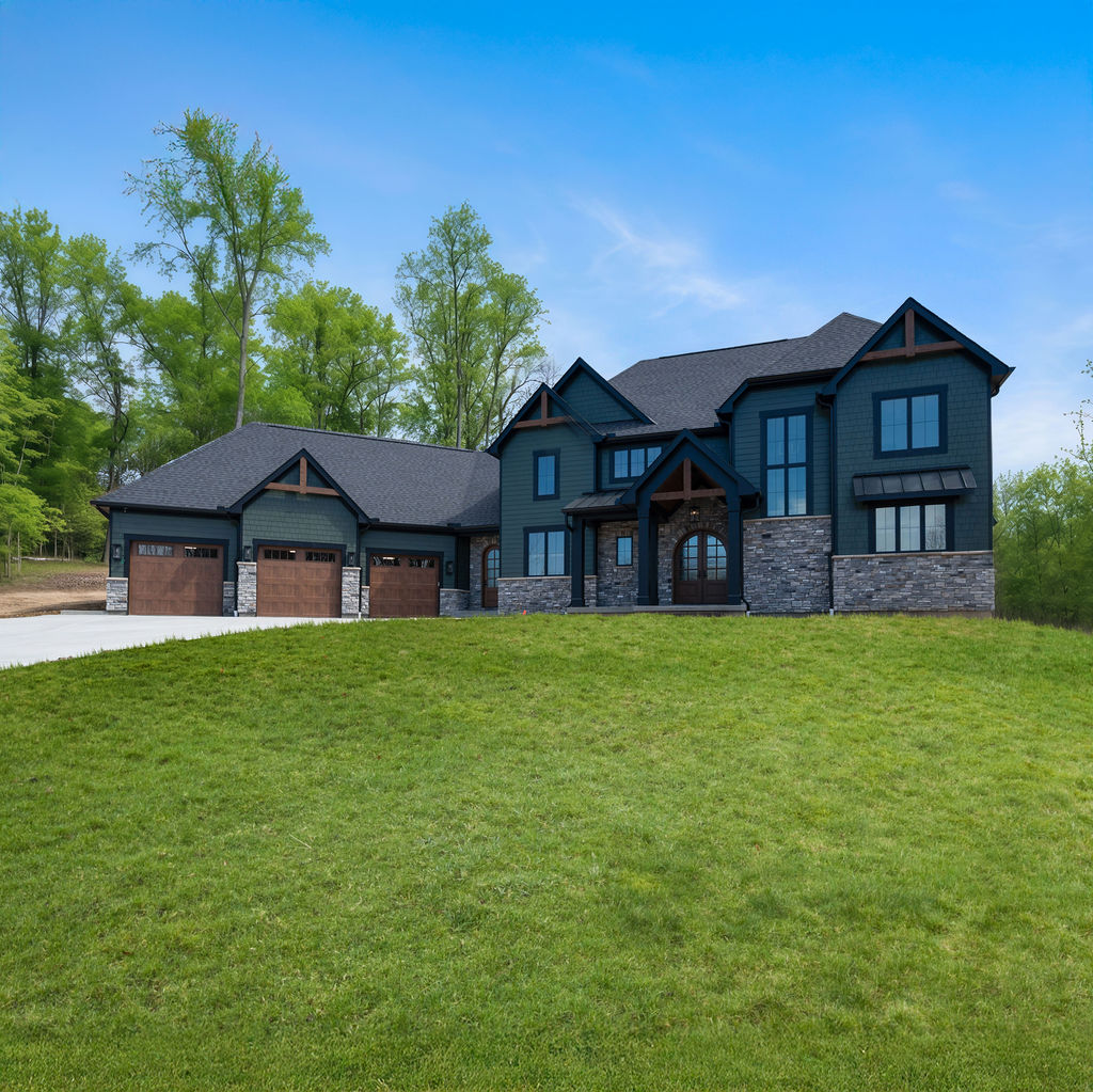 Two Story Custom Home Cleaves Stone Dark Green Siding Stone and Cedar Accents