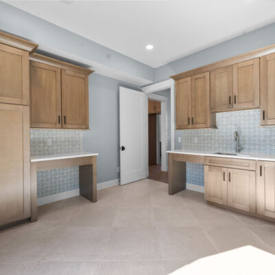 Wood Stained Cabinetry In Laundry with Pet Spaces