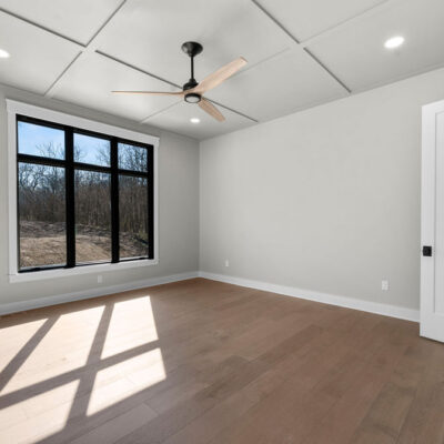 Primary Bedroom With Wainscotting Black Trim Windows