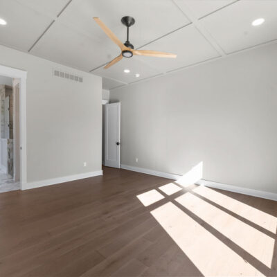 Primary Bedroom With Accent Wainscotting Ceiling Black trim windows