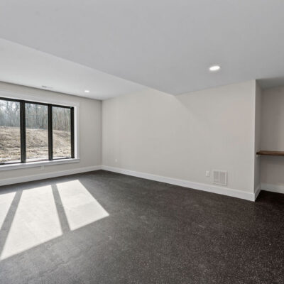 Lower Level Exercise Room With Custom Wood Shelf