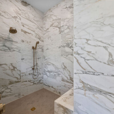 Oversized Tile on Walls and Herringbone Tile Shower Floor