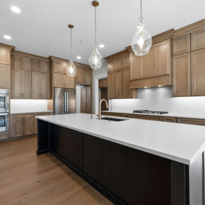 Wood Stain Cabinetry and Black Island at Bear Creek