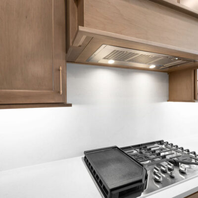 Custom Wood Stained Hood with Slab Backsplash
