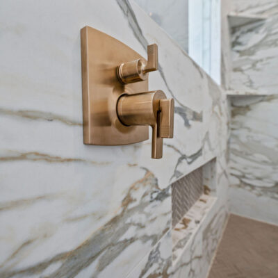 Primary Bathroom Shower With Alustra Imperial Gold Matte Tile 24x48 Gold Plumbing Hardware
