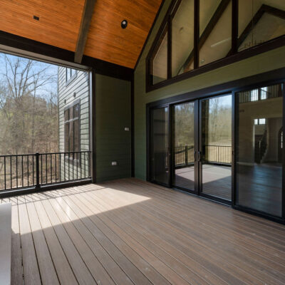 Screened Porch with Cathedral Ceiling and Stone Fireplace at Bear Creek Pella Sliding Doors