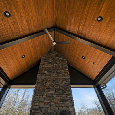 Screened-In Porch with Cathedral Ceiling and Stone Fireplace at Bear Creek Pella Sliding Doors