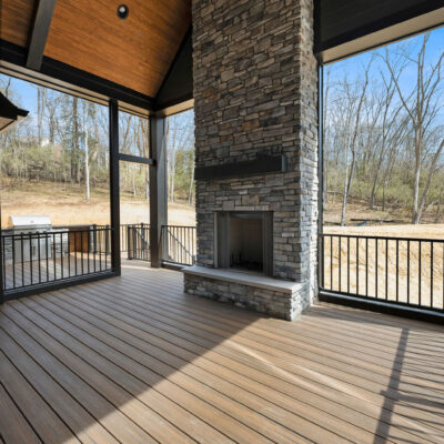 Screened Porch with Cathedral Ceiling and Stone Fireplace at Bear Creek Pella Sliding Doors and Custom Grilling Station