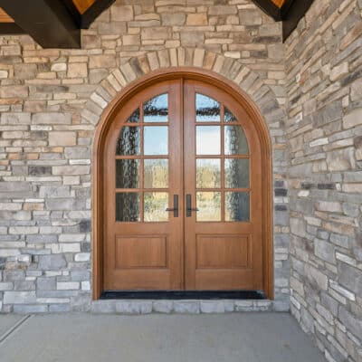Green House Siding, Stone Cedar and black accents on house, Arched door