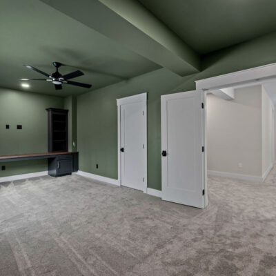 Lower Level Office With Acoustical Wood Panels and Butcher Block Desk Countertop
