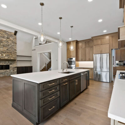 Custom Kitchen Wood-Stained Kitchen Cabinetry Black Island Open To Great Room