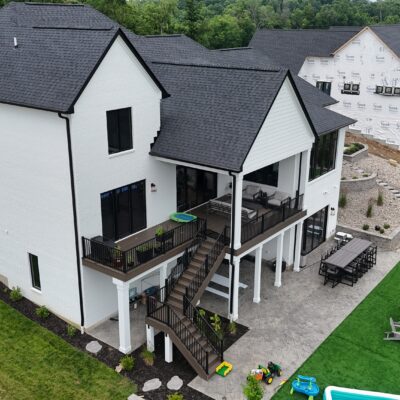 Covered porch and walk-out to multi-sport court
