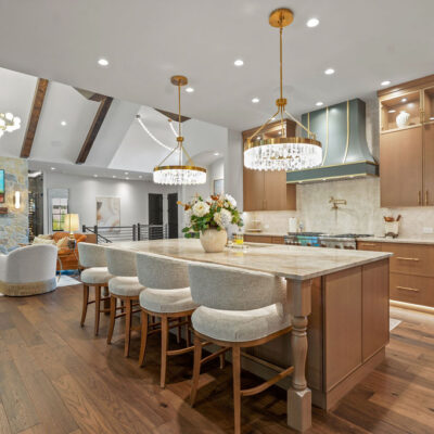 Main Kitchen with Large Island With Double Chandelier and Seating White Oak Rift Cut Cabinetry