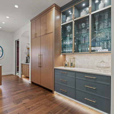 kitchen cabinetry with Homburg Gray and glass shelving with champaign accents