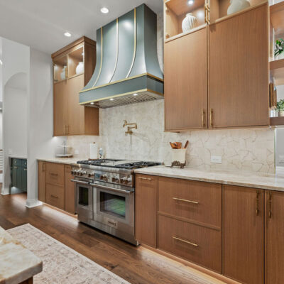 Kitchen hood painted Homburg Gray with Champaign gold straps