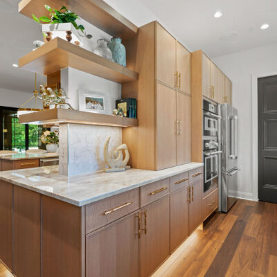 Open shelving with integrated lighting, pantry and Rift Cut White Oak Cabinetry
