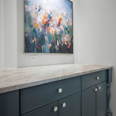 Kitchen art nook cabinetry painted Homburg Gray and Taj Mahal quartzite
