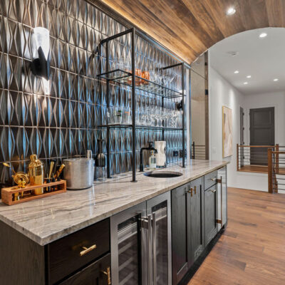 First Floor Wet Bar With Barrel Wood Ceiling and Wine Cellar With Glass Door