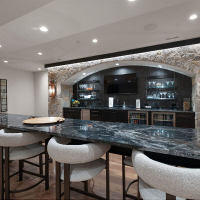 Double Sided Island Seating and Large Arched Stone Bar