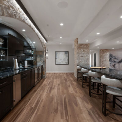 Double Sided Island Seating and Large Arched Stone Bar