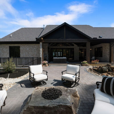 Rear paver patio with firepit seating area