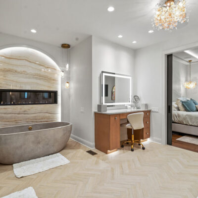 Cement Oversized Tub With Tiger Onyx Porcelain Slab Backsplash With Integrated Lighting