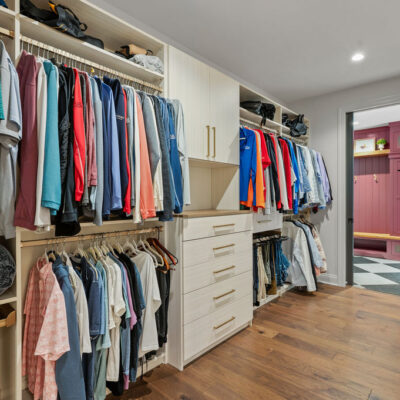 Walk-In Closet Between Primary Bedroom and Mudroom