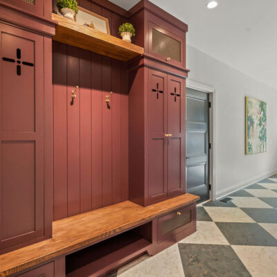 Custom Mudroom Bench and Lockers in Laundry with largescale checkerboard flooring tile moody color