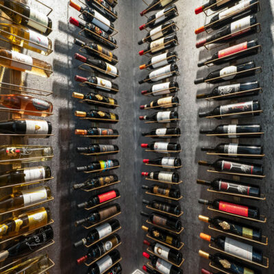 Wine Cellar With Bottle Display and Cork Textured Wallpaper With Metallic Shine