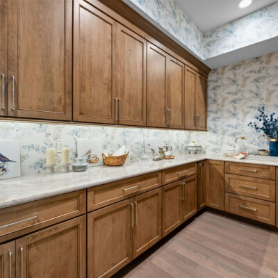 Walk-In Kitchen Pantry With Open Shelving and Closed Custom Cabinetry