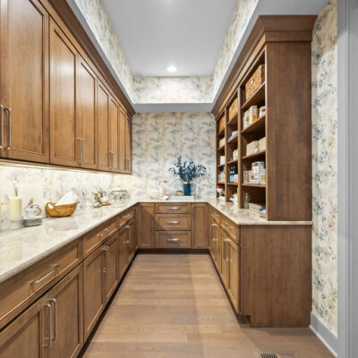 Walk-In Kitchen Pantry With Open Shelving and Closed Custom Cabinetry