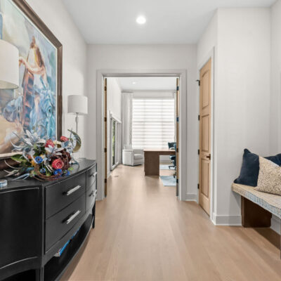Hall With Window and Bench Between Entry and Home Office