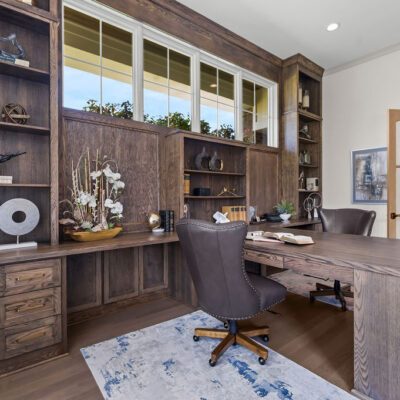 Home Office With Custom Wood Stained Built-Ins His and Her Peninsula Desk and Access To Screened In Porch