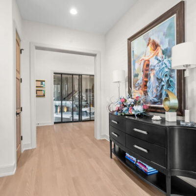 Hall With Window and Bench Between Entry and Home Office