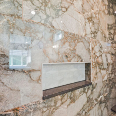 Guest Bathroom With Large Ceramic Tile and Niche