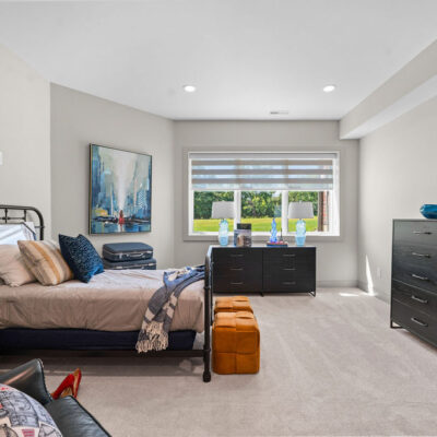 Lower Level Bedroom With Walk-In Closet Travel Theme