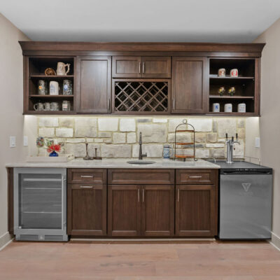 Lower Level Wet Bar With Stone Backsplash, Beverage Cooler and Kegerator Wood Stained Custom Cabinetry