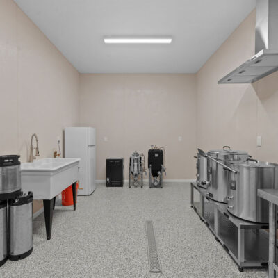 Home Brewery Room in Lower Level With Linear Floor Drain and Hood and Germany Themed Wall Mural