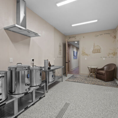 Home Brewery Room in Lower Level With Linear Floor Drain and Hood and Germany Themed Wall Mural