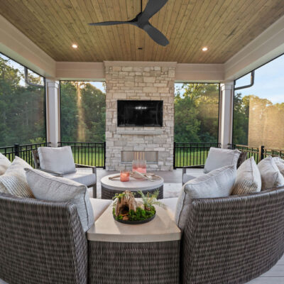 Covered Screened In Porch With Stone Fireplace