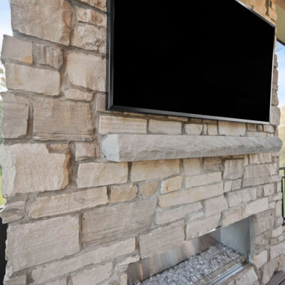 Covered Screened In Porch With Stone Fireplace