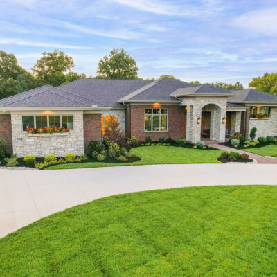 Arched Stone Entry with Brick covered Porch Modern Transitional Ranch Custom Home