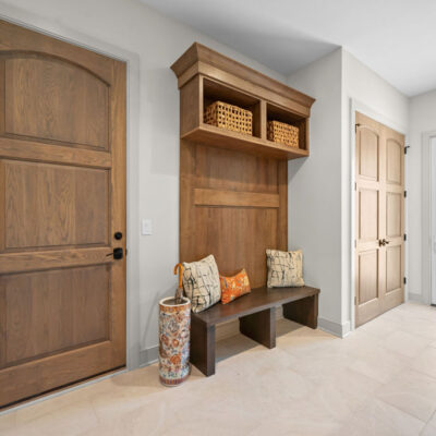 Back Hall Mudroom With Walk-Out and Bench Seat With Cabinetry, Beverage Cooler and Drop Zone
